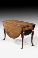 A George II Period Mahogany Carved Cabriole Leg Drop-Leaf Dining Table
