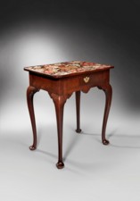 A rare George I period mahogany cabriole leg centre table with framed needlework...