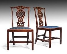 A rare and exquisitely carved pair of early George III period mahogany side chai...