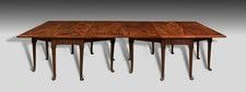 A particularly rare George II period mahogany twin drop leaf dining table.